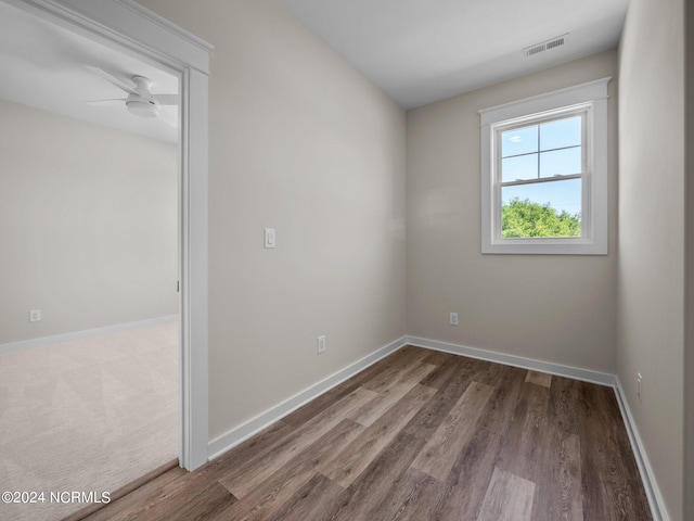 unfurnished room with hardwood / wood-style floors and ceiling fan