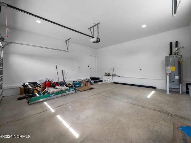 garage with a garage door opener and water heater