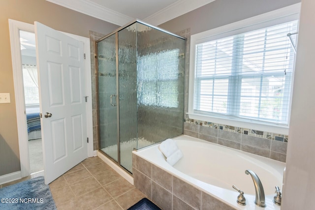 bathroom featuring ornamental molding, tile flooring, and separate shower and tub