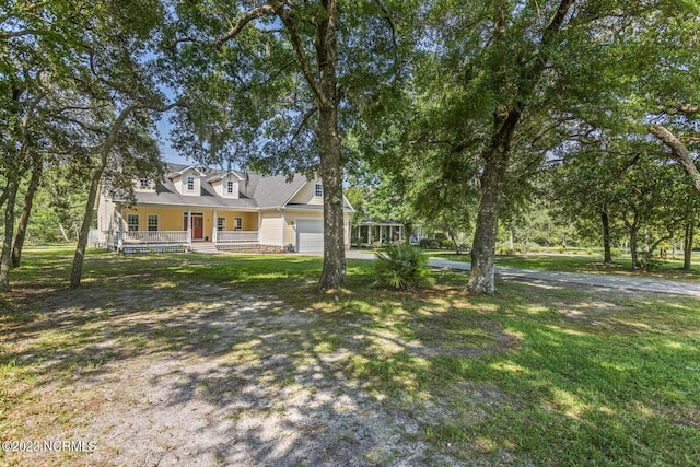 cape cod-style house featuring a front yard