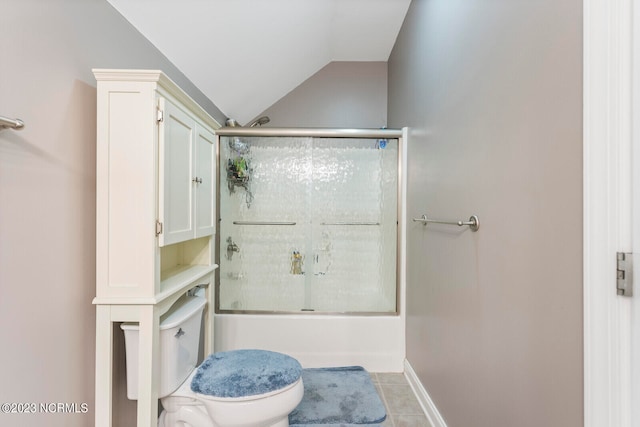 bathroom featuring enclosed tub / shower combo, toilet, vaulted ceiling, and tile flooring