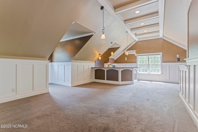 additional living space featuring light carpet and vaulted ceiling