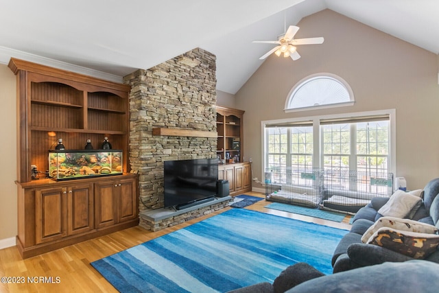 living room with high vaulted ceiling, light hardwood / wood-style floors, ceiling fan, and a fireplace