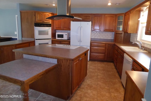 kitchen with white appliances, sink, island range hood, and light tile floors