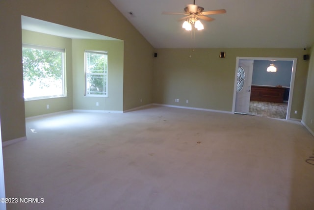 unfurnished room with light colored carpet, ceiling fan, and lofted ceiling