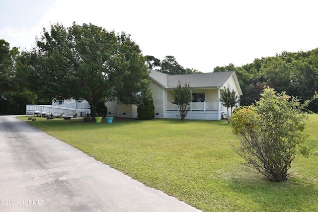 view of front of home featuring a front yard and a porch