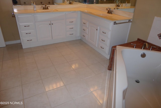 bathroom with tile flooring, large vanity, and a washtub