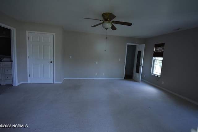 unfurnished bedroom featuring carpet and ceiling fan