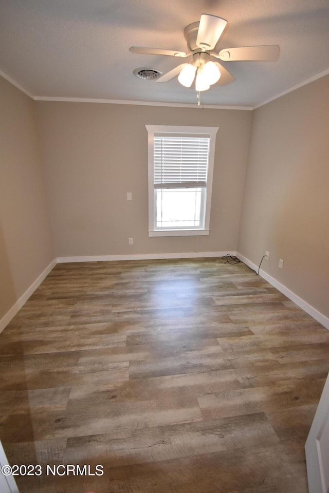 unfurnished room with ceiling fan, ornamental molding, and hardwood / wood-style floors