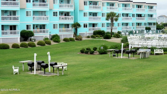 view of home's community featuring a lawn