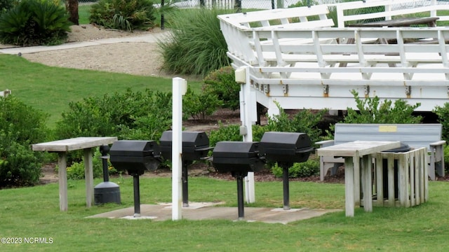 surrounding community featuring a yard and a pergola