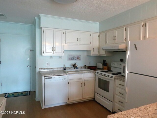 kitchen featuring white cabinets, white appliances, light hardwood / wood-style flooring, and sink