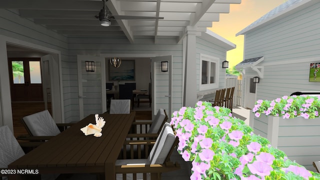 view of patio featuring outdoor dining area and a ceiling fan
