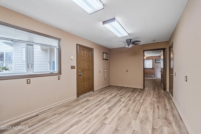 foyer entrance with light hardwood / wood-style flooring and ceiling fan