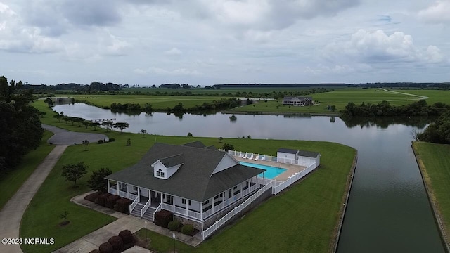 birds eye view of property featuring a water view