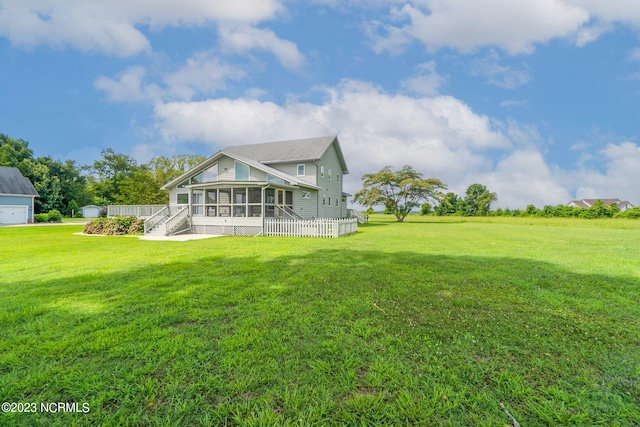 view of yard with a sunroom