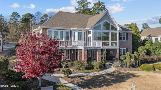 view of front of home with a sunroom