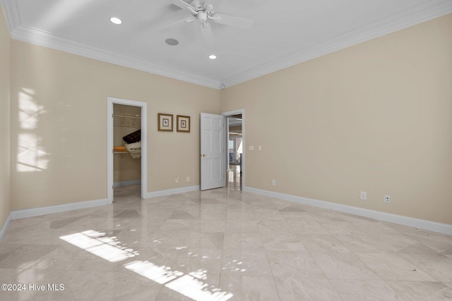 unfurnished room featuring ceiling fan and crown molding