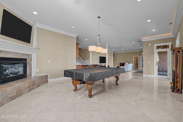 rec room featuring a tile fireplace, ornamental molding, and pool table