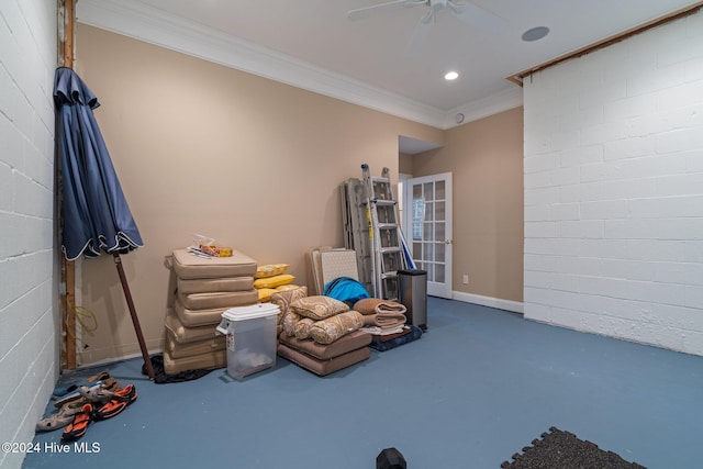 game room with ceiling fan and crown molding