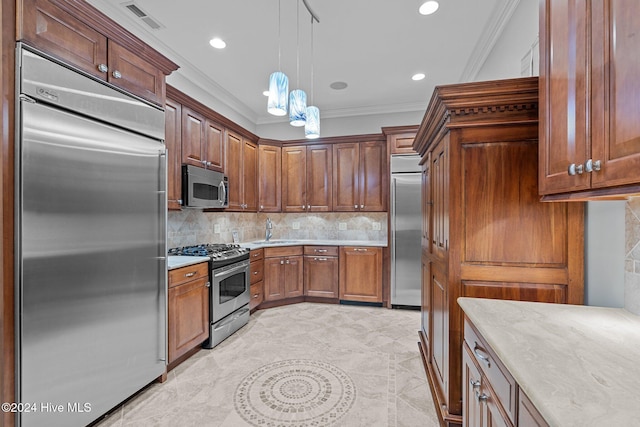 kitchen featuring decorative backsplash, crown molding, stainless steel appliances, and hanging light fixtures