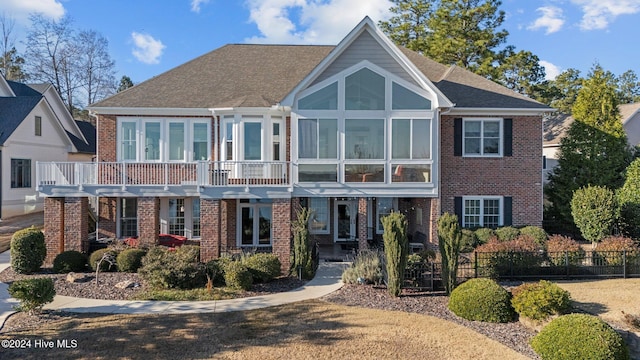 view of front of house featuring a balcony