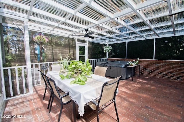 view of terrace featuring a hot tub