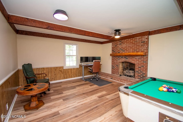 playroom featuring a fireplace, brick wall, ceiling fan, pool table, and light hardwood / wood-style flooring