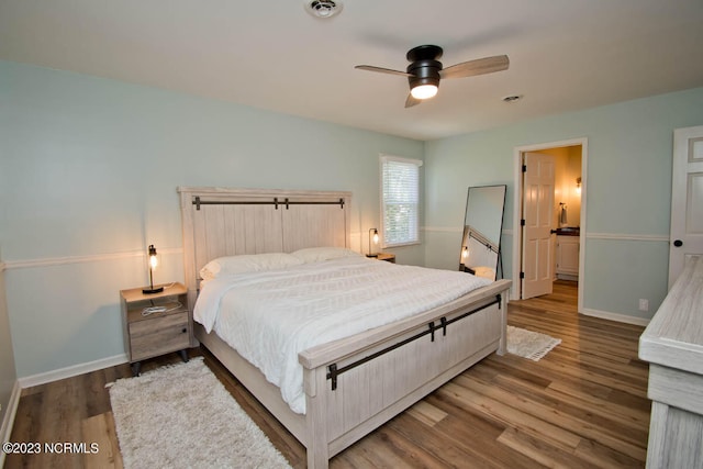 bedroom featuring ceiling fan, connected bathroom, and wood-type flooring