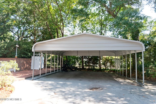 view of parking / parking lot featuring a carport