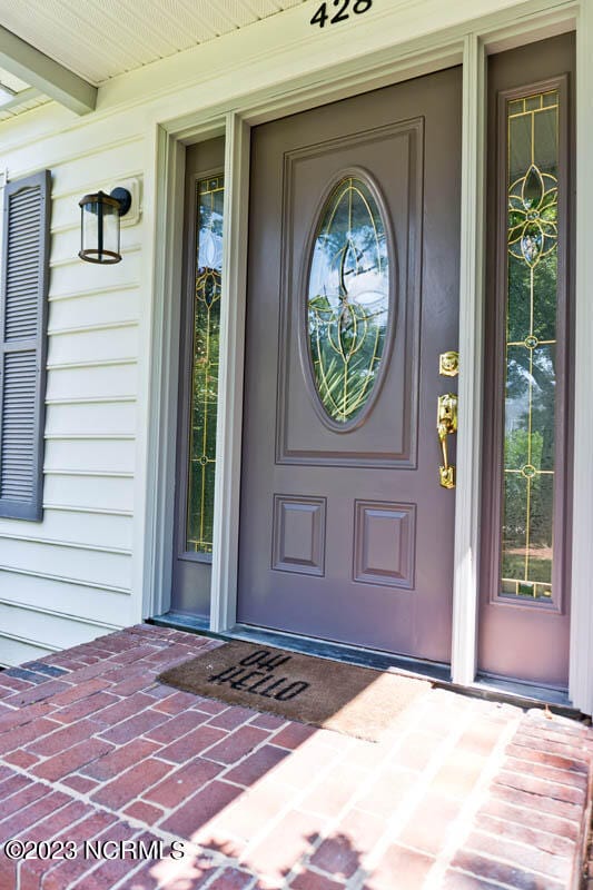 doorway to property with covered porch