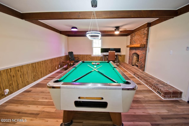 playroom featuring a fireplace, ceiling fan, pool table, and light hardwood / wood-style flooring