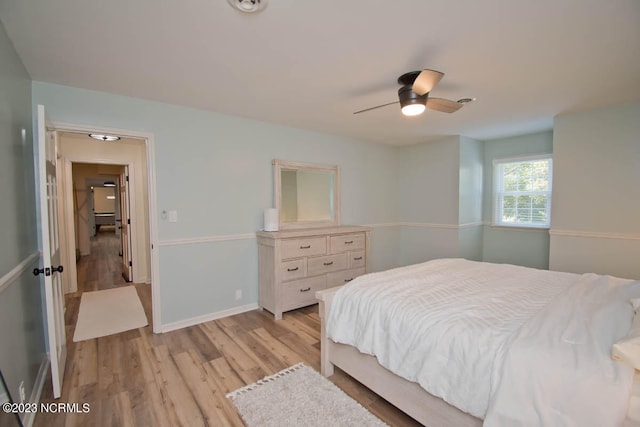 bedroom featuring ceiling fan and light hardwood / wood-style floors