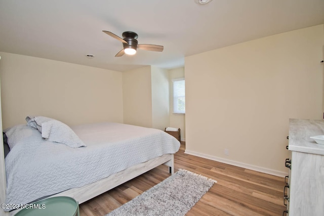 bedroom featuring light hardwood / wood-style floors and ceiling fan