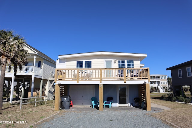 view of front of property featuring a wooden deck and a garage