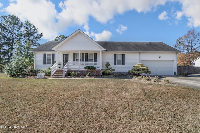 ranch-style home with a porch, a garage, and a front lawn