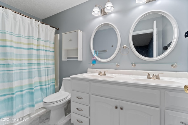 full bathroom featuring vanity, shower / bath combination with curtain, a textured ceiling, and toilet