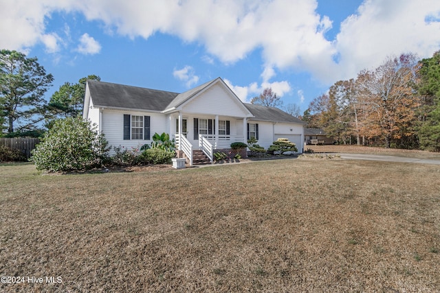 ranch-style house with a front yard, a porch, and a garage