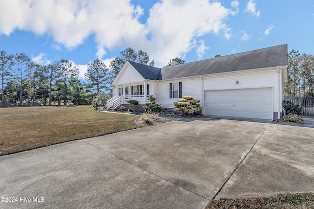 view of front facade with a front lawn and a garage