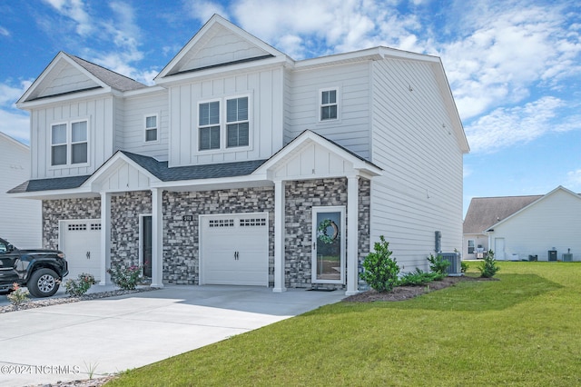 view of front of house with a garage, a front yard, and central air condition unit