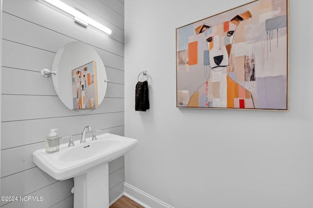 bathroom with hardwood / wood-style floors