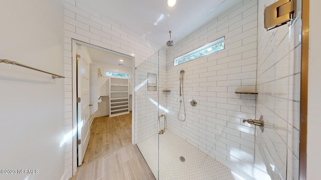 2090 Greenside Manor Dr Unit L-39, Ocean Isle Beach, NC 28469 - full bathroom with tiled shower and a spacious closet