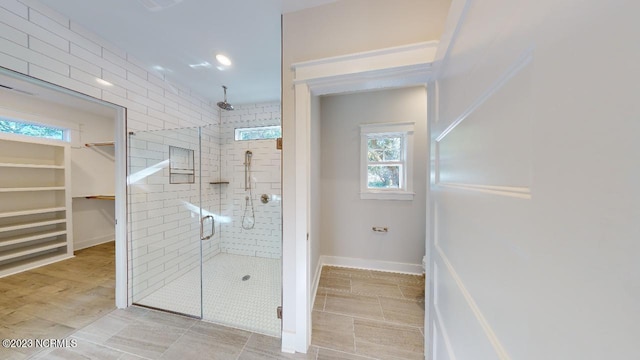 2090 Greenside Manor Dr Unit L-39, Ocean Isle Beach, NC 28469 - bathroom featuring a stall shower and a spacious closet