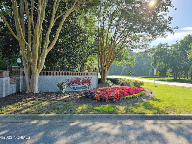 2090 Greenside Manor Dr Unit L-39, Ocean Isle Beach, NC 28469 - community / neighborhood sign with a yard