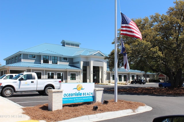 2090 Greenside Manor Dr Unit L-39, Ocean Isle Beach, NC 28469 - view of building exterior with uncovered parking