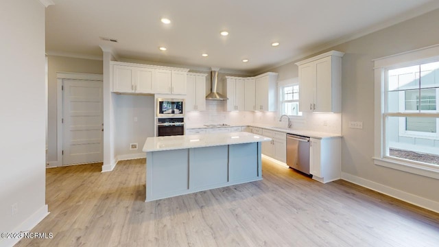 2090 Greenside Manor Dr Unit L-39, Ocean Isle Beach, NC 28469 - kitchen featuring stainless steel appliances, crown molding, backsplash, white cabinets, and a center island