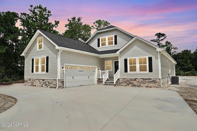 235 Weathersbee Dr, Hampstead, NC 28443 - craftsman-style home featuring a garage, central air condition unit, and concrete driveway