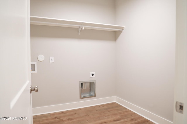 235 Weathersbee Dr, Hampstead, NC 28443 - laundry area featuring washer hookup, laundry area, electric dryer hookup, baseboards, and light wood-style floors