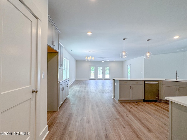 235 Weathersbee Dr, Hampstead, NC 28443 - kitchen featuring open floor plan, light wood-type flooring, gray cabinets, a sink, and dishwasher