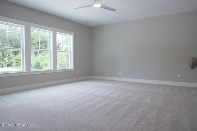 235 Weathersbee Dr, Hampstead, NC 28443 - spare room with baseboards, light carpet, and a ceiling fan